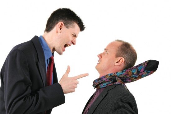 young man arguing with dad - dealing with issues of a young adult after graduation